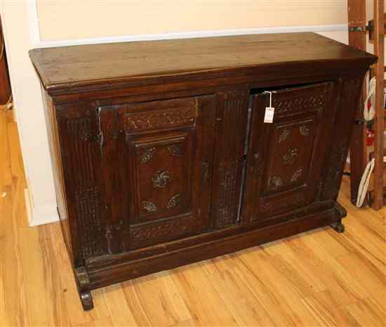 Appraisal: An th century Tuscan walnut low cupboard with two carved