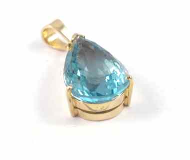 Appraisal: BLUE TOPAZ AND FOURTEEN KARAT GOLD PENDANT set with a