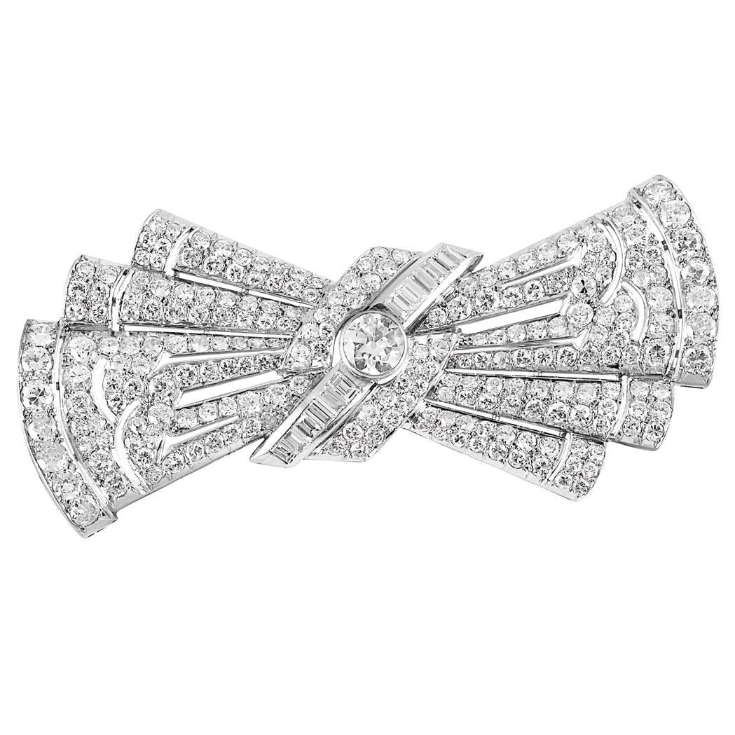 Appraisal: Platinum and Diamond Bow Brooch The stylized bow centering one