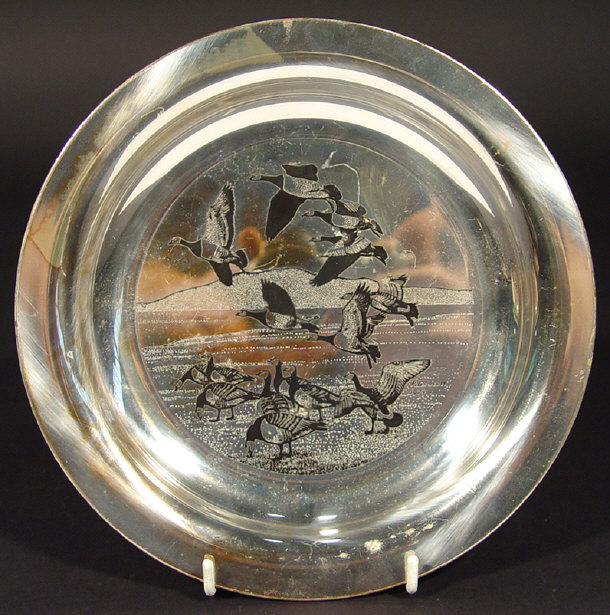 Appraisal: Silver plate decorated with a scene of flying geese after