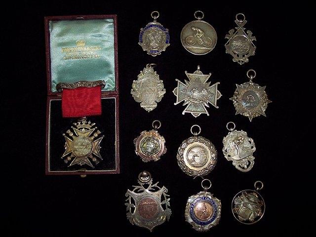 Appraisal: A silver Maltese cross shaped swimming medallion Birmingham four other