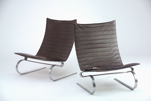 Appraisal: POUL KJAERHOLM Pair of PK lounge chairs with chocolate brown