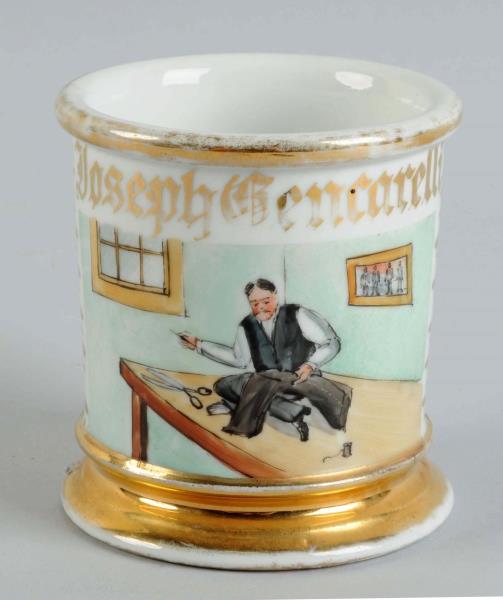 Appraisal: Tailor Shaving Mug Mug depicts a tailor sewing a pair