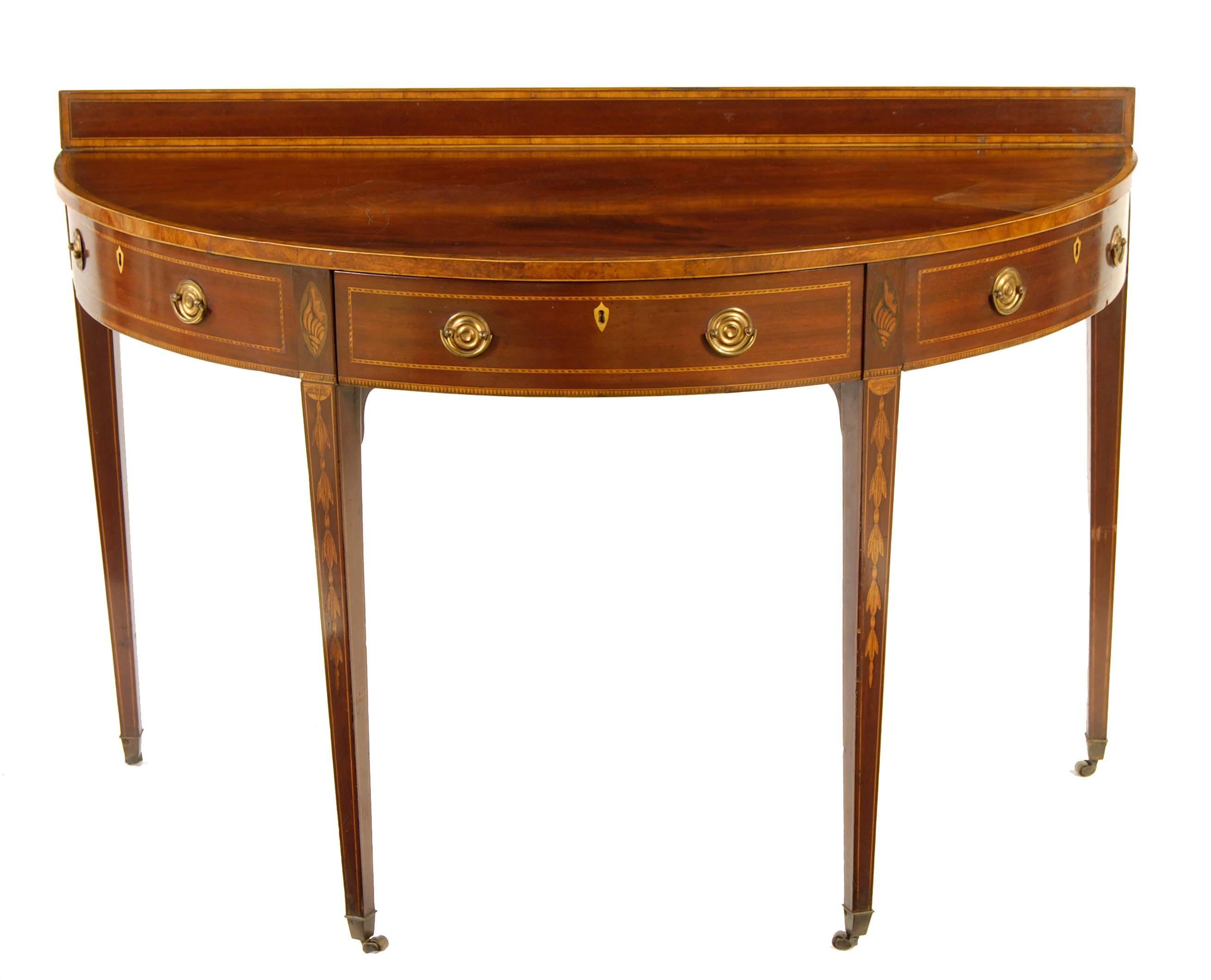 Appraisal: A mahogany demi-lune side table