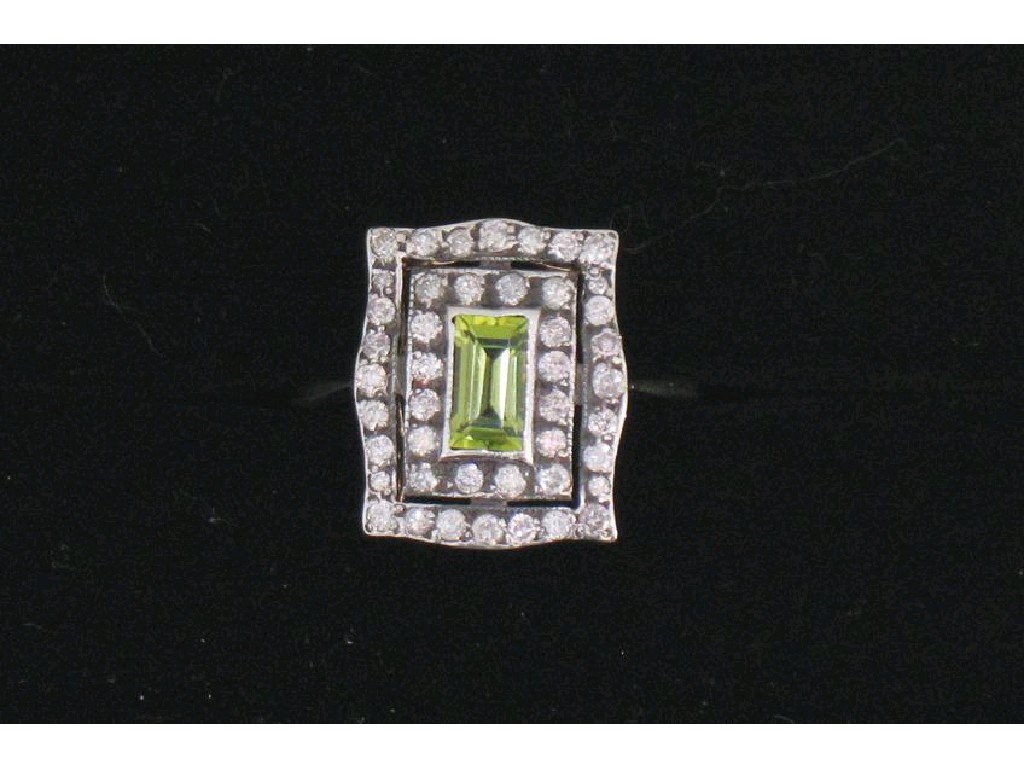 Appraisal: AN ART NOUVEAU STYLE PERIDOT AND DIAMOND DRESS RING the