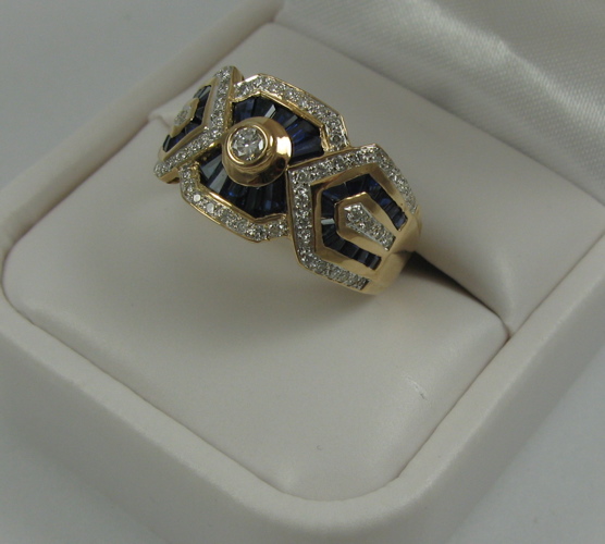 Appraisal: MAN'S SAPPHIRE DIAMOND AND K GOLD RING set with tapered