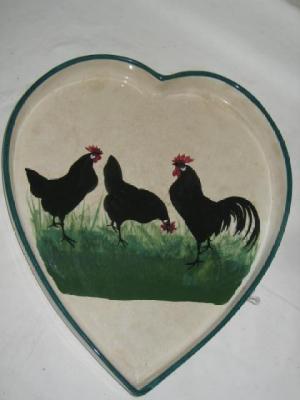 Appraisal: A WEMYSS POTTERY DISH of heart form painted with three