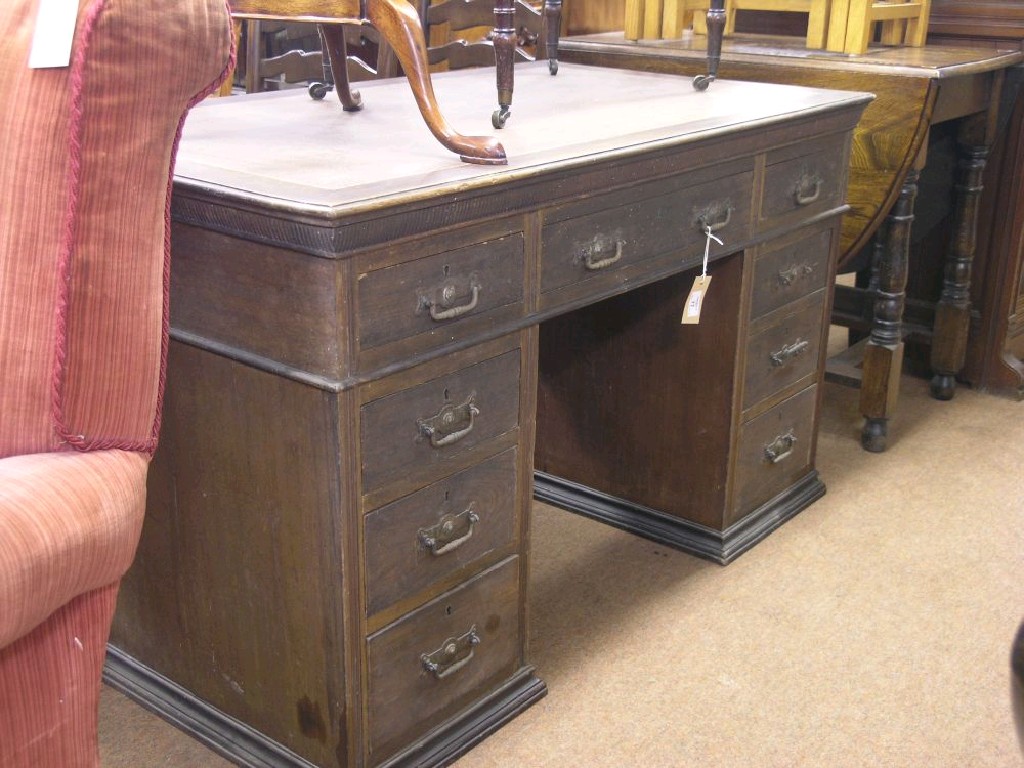 Appraisal: An Edwardian walnut pedestal desk top with inset vinyl three