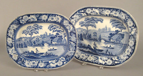 Appraisal: Two ironstone platters th c depicting fishermen in a landscape