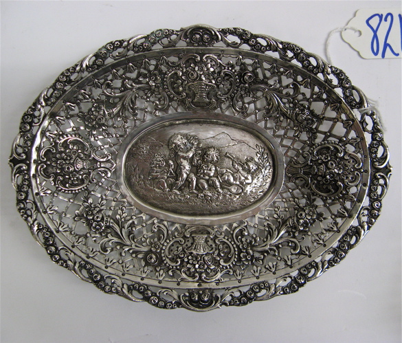 Appraisal: GERMAN FINE SILVER OVAL CANDY DISH ornate reticulated repousse design