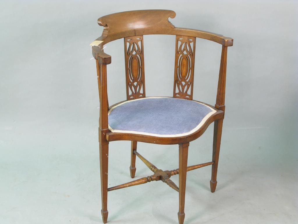 Appraisal: An Edwardian inlaid mahogany corner-fitting armchair with shaped cresting and