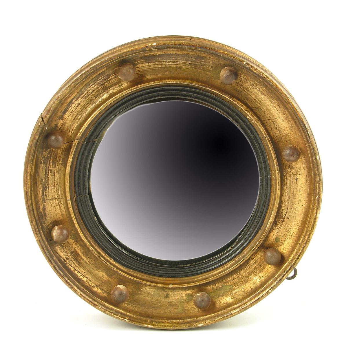 Appraisal: A small giltwood and gesso convex mirror