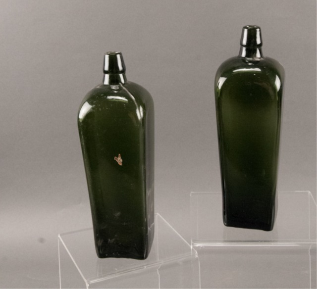 Appraisal: Two th Century Green Glass Gin Bottles Unmarked No chips