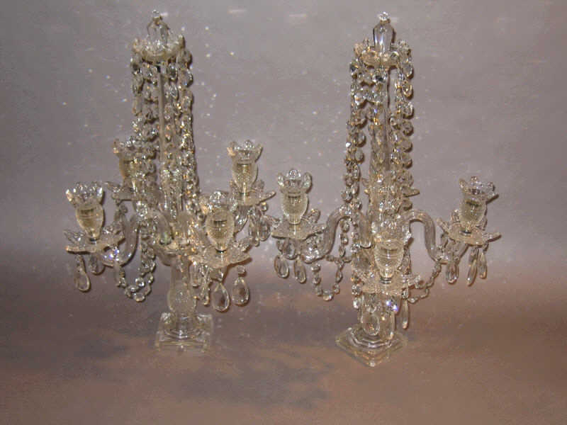 Appraisal: PAIR CONTINENTAL CRYSTAL CANDLEABRA The faceted central shaft supports eight