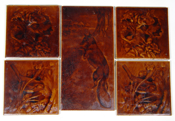 Appraisal: Five Victorian brown glazed pottery tiles one large depicting a