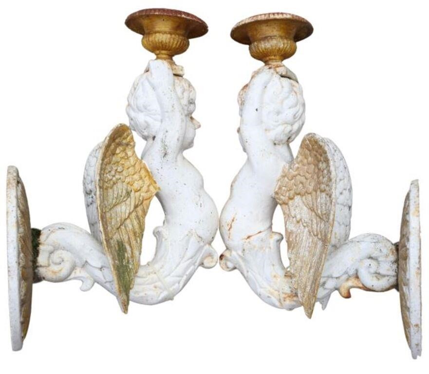 Appraisal: pair Cast iron wall-mounted garden candle sconces th c winged