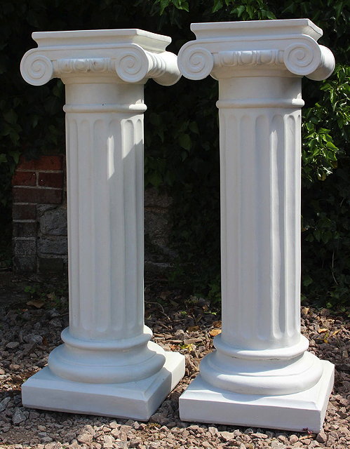 Appraisal: A PAIR OF COMPOSITE PLINTHS of fluted column form cm