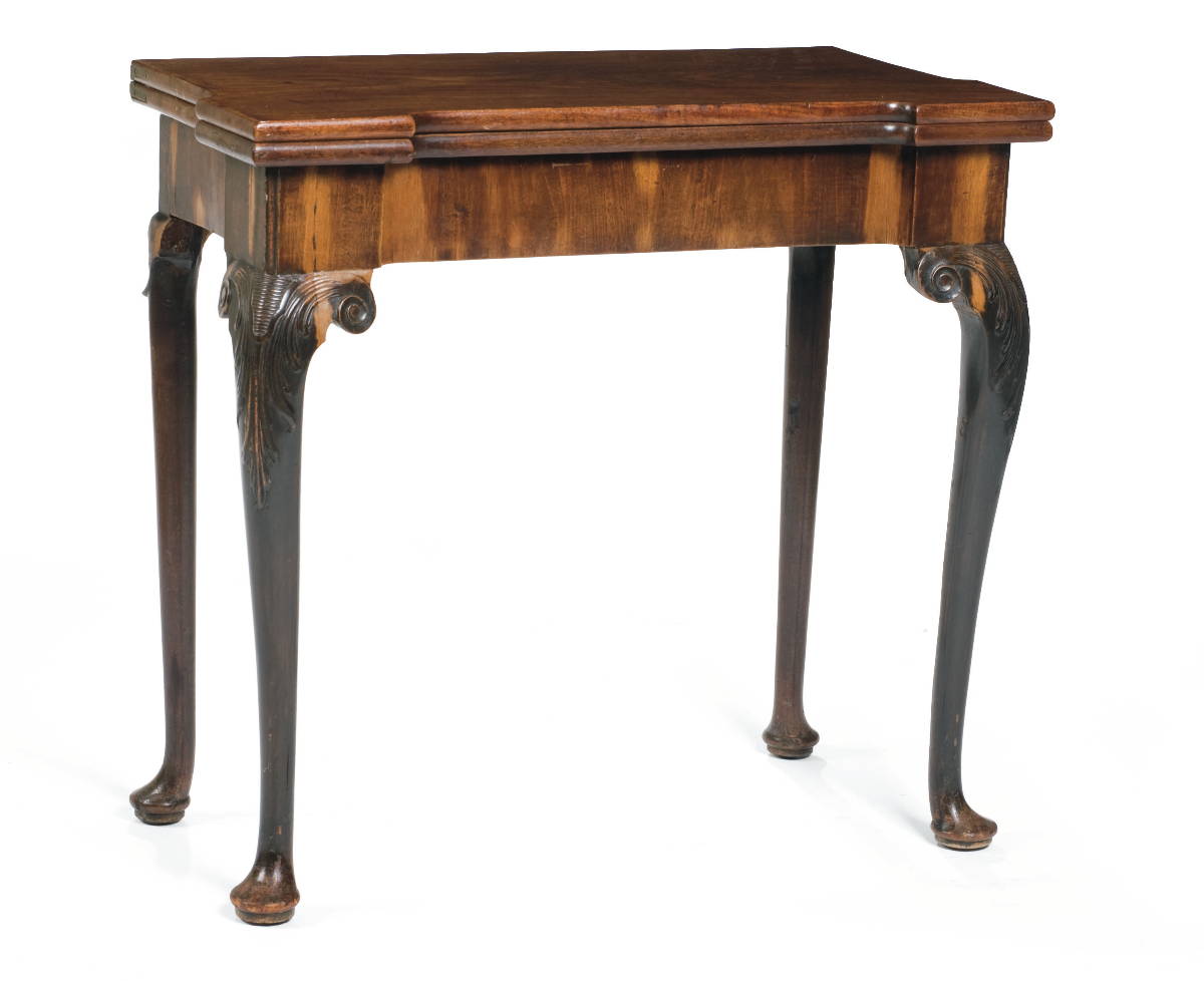 Appraisal: GEORGIAN CARVED MAHOGANY CARD TABLE The hinged rectangular top with