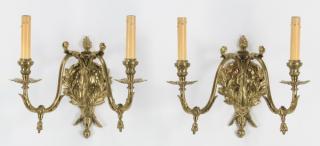 Appraisal: Neoclassical style two Pair of gilt metal two-light sconces in