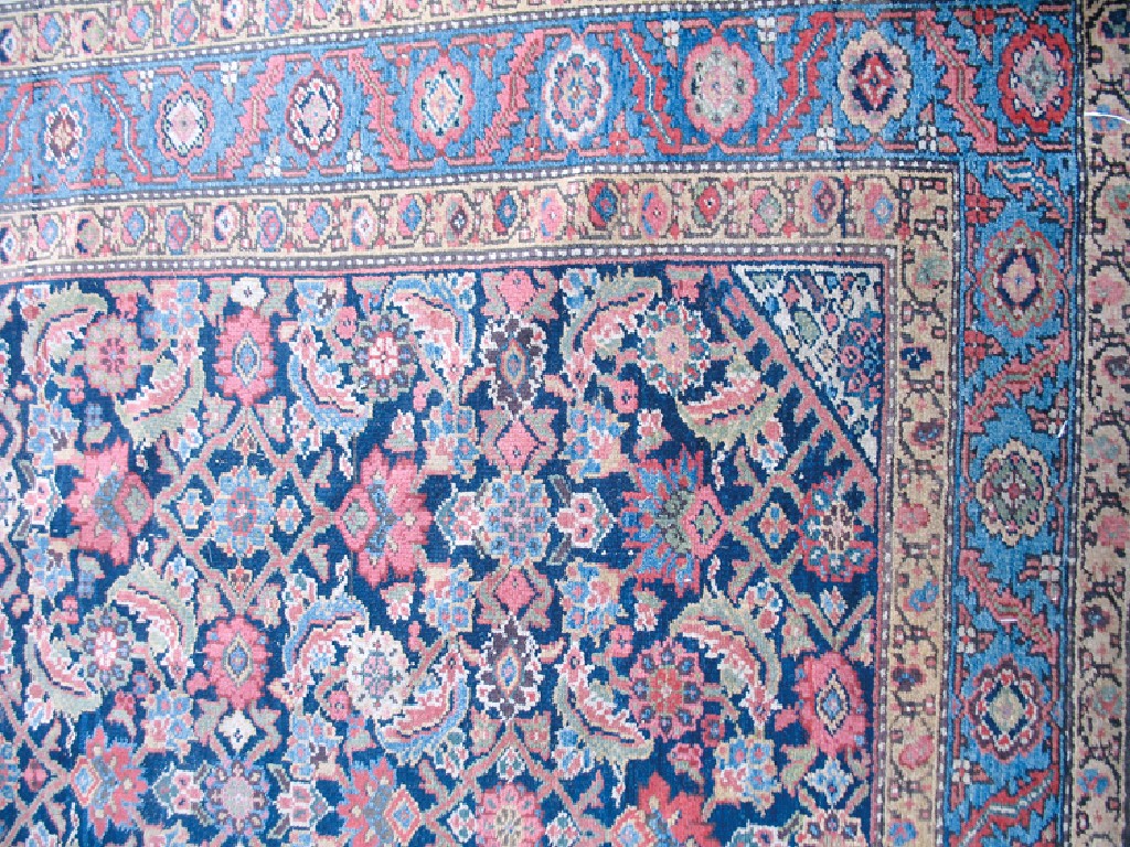 Appraisal: A NORTH WEST PERSIAN RUG the central dark blue rectangular