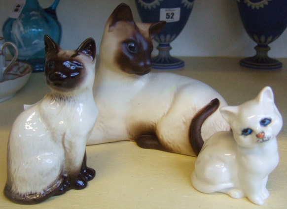 Appraisal: A group of three Beswick cats to include two Siamese