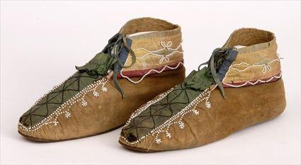 Appraisal: PAIR OF WOODLANDS BEADED-HIDE MOCCASINS in