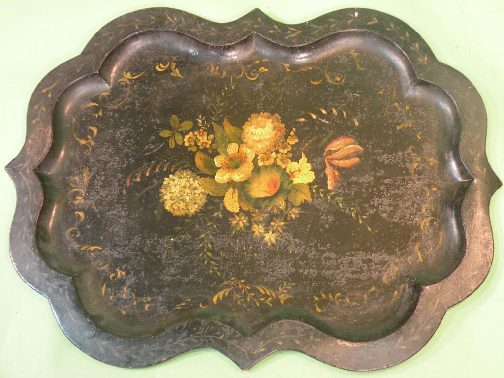 Appraisal: A mid Victorian tole ware tray with a shaped border