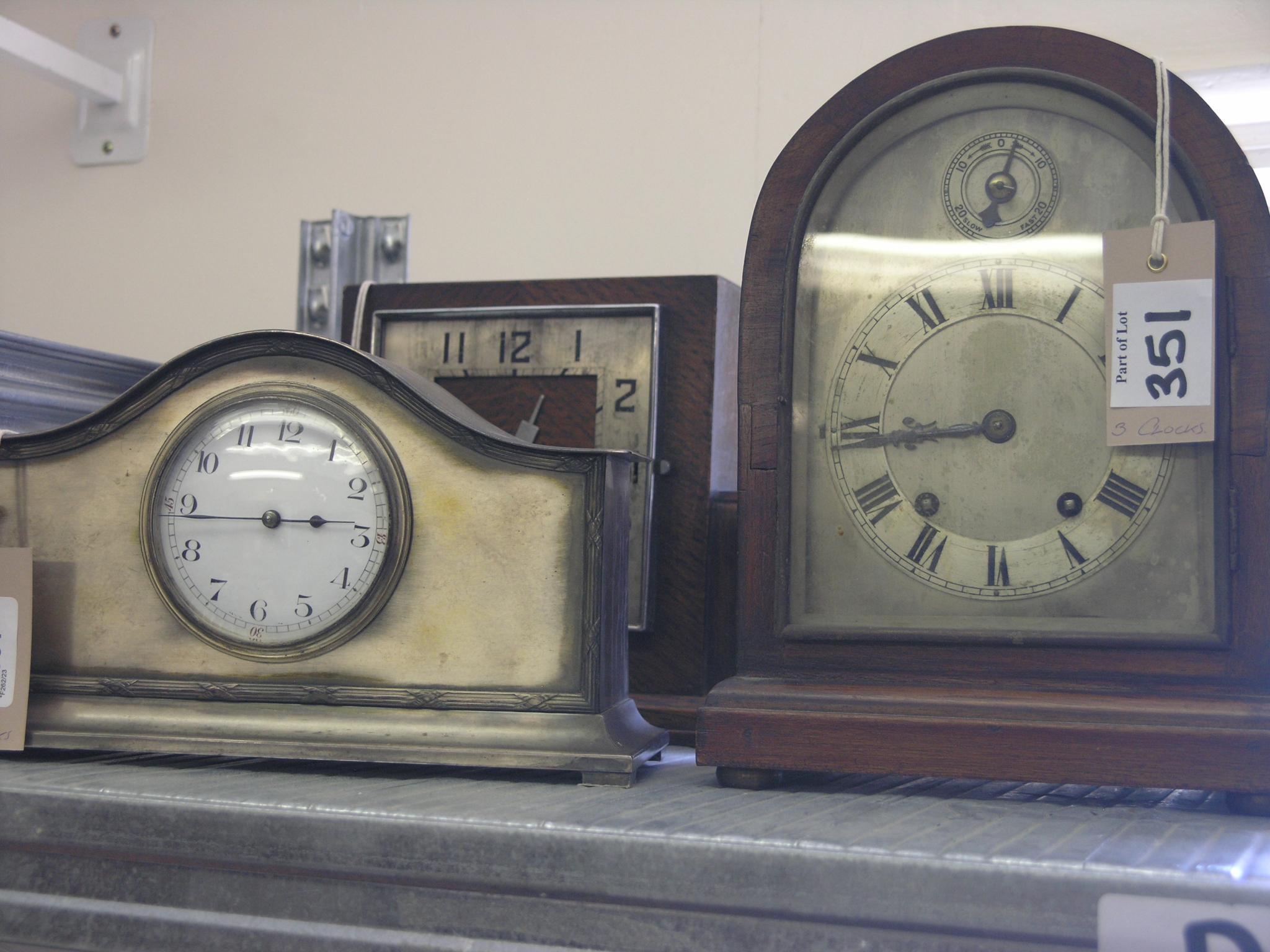 Appraisal: A domed mantel clock with arched silvered dial French movement