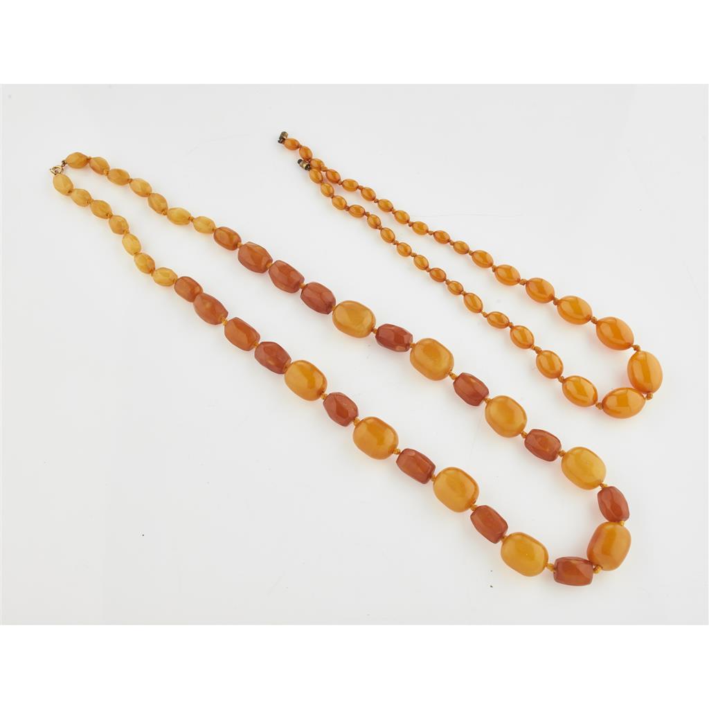 Appraisal: Two yellow amber bead necklaces the first composed of a