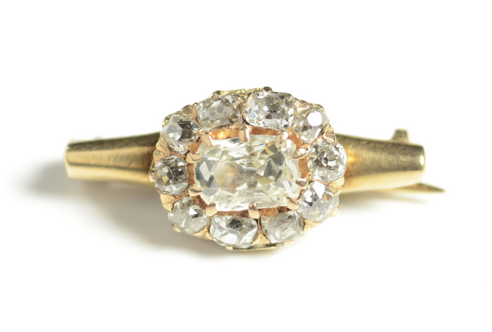 Appraisal: DIAMOND AND TEN KARAT GOLD PIN with ten old mine