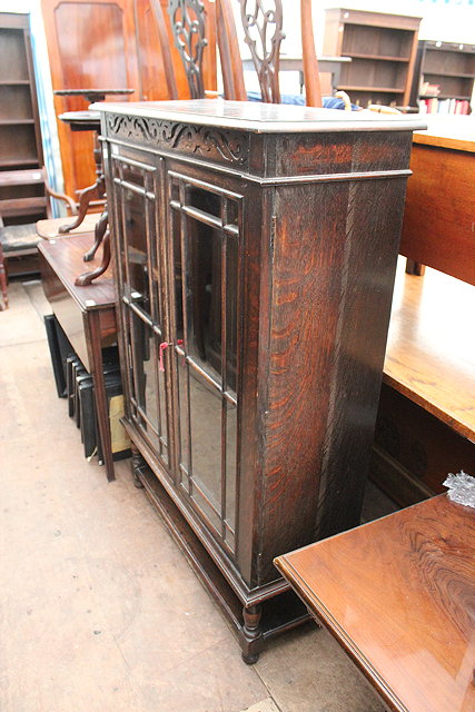 Appraisal: A GLAZED OAK BOOKCASE x cm