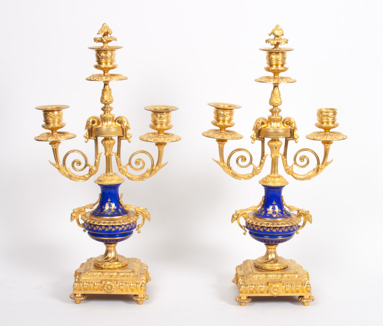 Appraisal: Pair of Louis XVI style gilt-bronze candelabra three-light urn-form candelabra