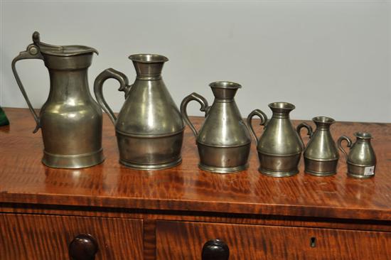 Appraisal: FIVE PEWTER MEASURES AND A FLAGON Five graduated haystack measures