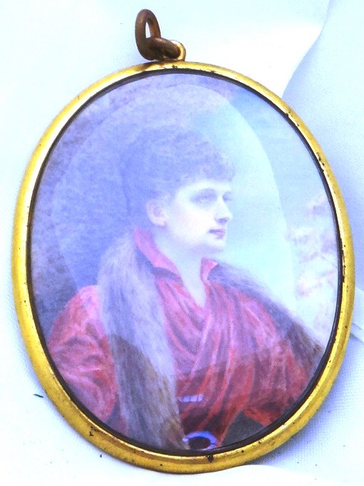 Appraisal: An oval portrait miniature of a lady with curly brown