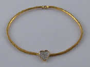 Appraisal: An carat gold collar necklace with diamond set heart necklace