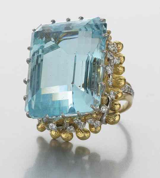 Appraisal: K gold aquamarine and diamond ringfeaturing a central emerald cut