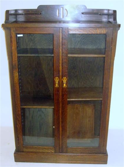 Appraisal: Arts and Crafts oak bookcaselate th century