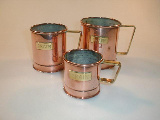 Appraisal: A set of three early thC graduated copper grain measures