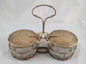 Appraisal: A silver mounted double pickle condiment pot with automatic opening