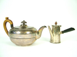 Appraisal: A George III silver teapot of squat form with central