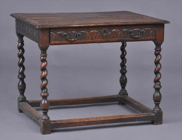 Appraisal: JACOBEAN CARVED OAK SIDE TABLE The molded top above a