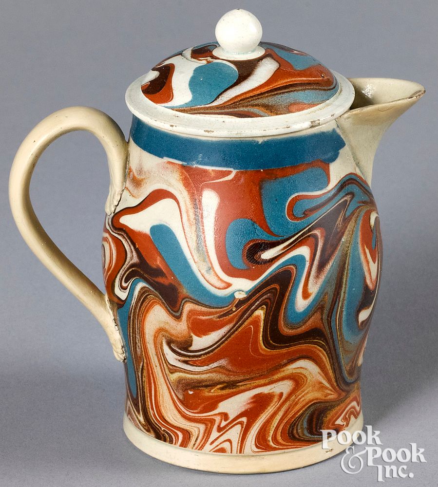 Appraisal: Mocha lidded pitcher with marbleized glaze Mocha lidded pitcher with