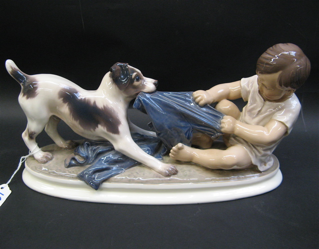 Appraisal: DAHL JENSEN GLAZED PORCELAIN FIGURAL GROUP Fox Terrier with Boy