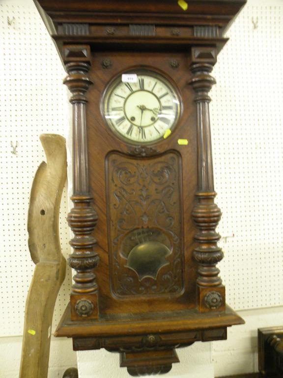 Appraisal: A thC walnut Vienna wall clock with an ornately carved