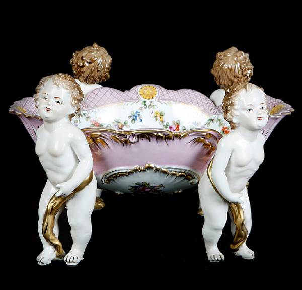 Appraisal: A pair of German style porcelain figural compotes height in