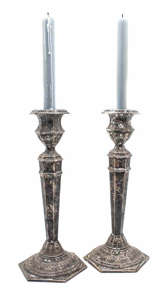 Appraisal: A Pair of Silverplate Candlesticks having a faceted baluster candle