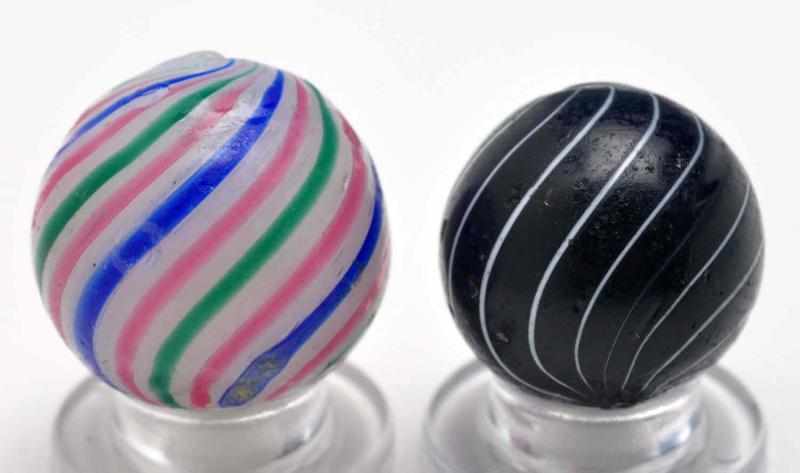 Appraisal: Lot of Clambroth Marbles Description Smaller marble has a black