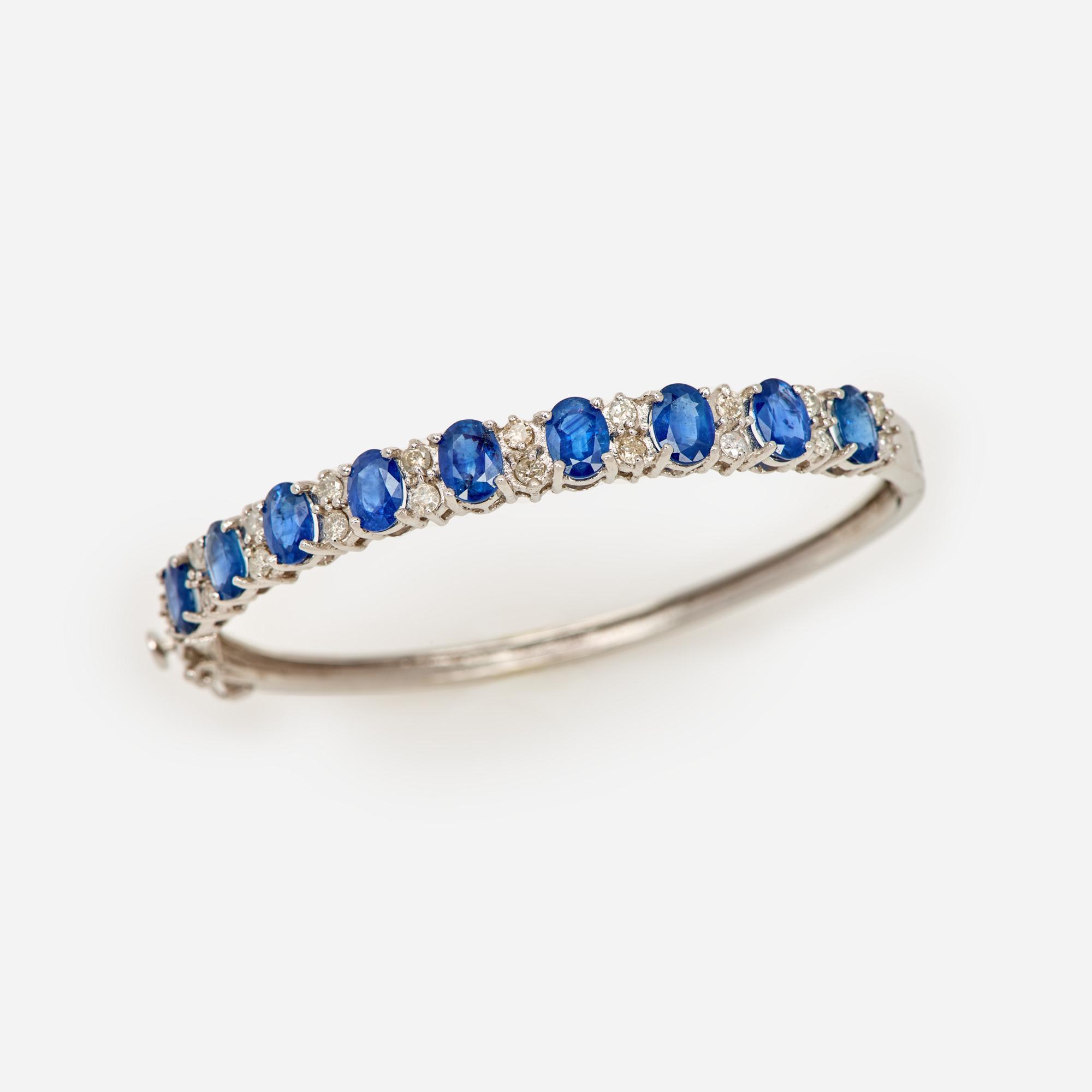 Appraisal: SAPPHIRE AND DIAMOND HINGED BRACELET IN K A k white