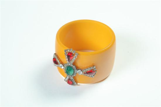 Appraisal: BAKELITE BEJEWELED BANGLE American Ca - Wide yellow bangle with