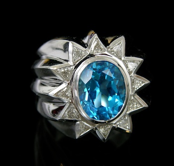 Appraisal: A Massive White Gold Ring with Blue Topaz and Diamonds